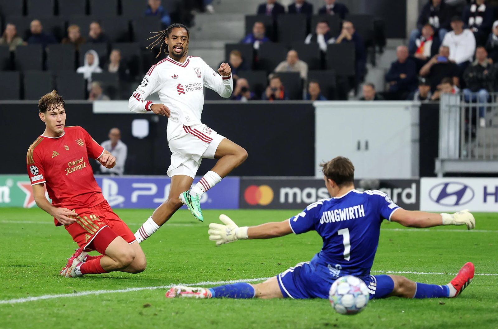 Bradley Barcola, in Liverpool's white away kit, watches his shot beat LASK goalkeeper Lukas Jungwirth